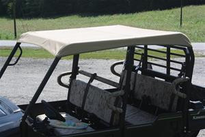 Greene Mountain tan soft top on a camo Kawasaki Mule ProFXT, rear three-quarter view over the bed and rear seats