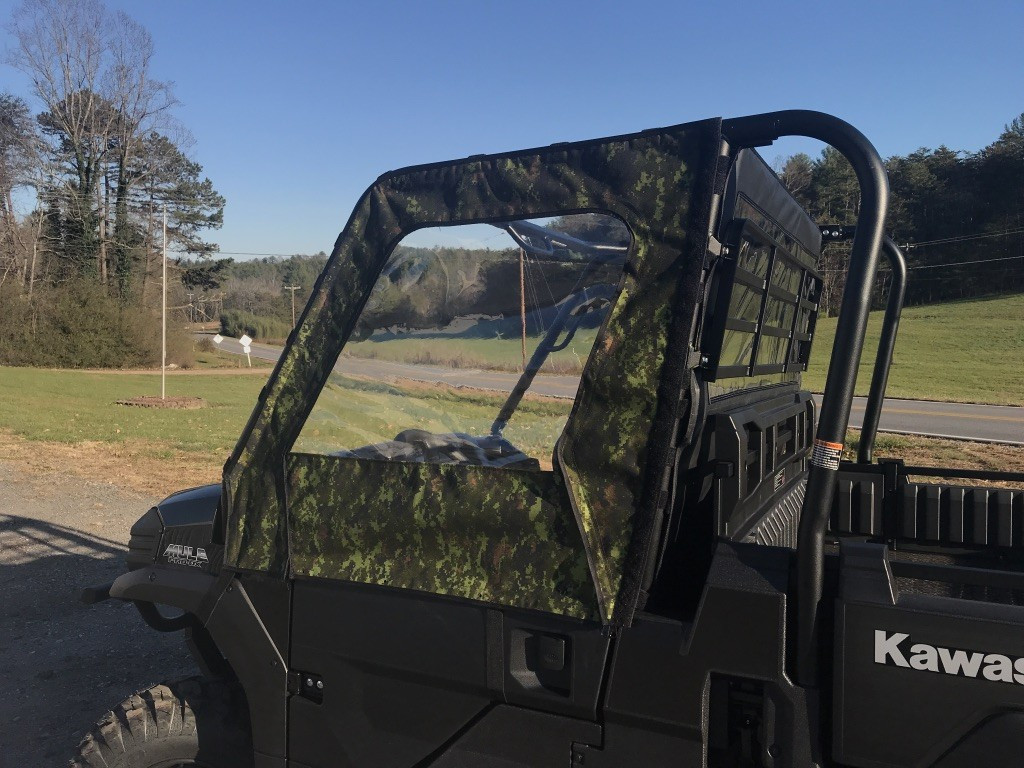 Greene Mountain camo soft door on a Kawasaki Mule ProFX, front quarter view with the clear window