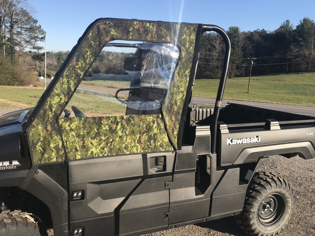 Greene Mountain camo soft doors on a Kawasaki Mule ProFX, side view beside the Kawasaki decal