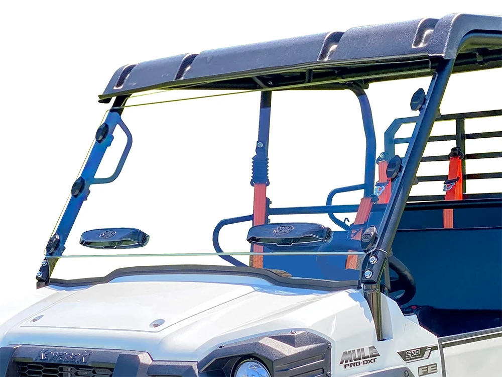 Spike windshield for Kawasaki Mule Pro-FX: vented windshield on a white Kawasaki Mule, front corner close-up
