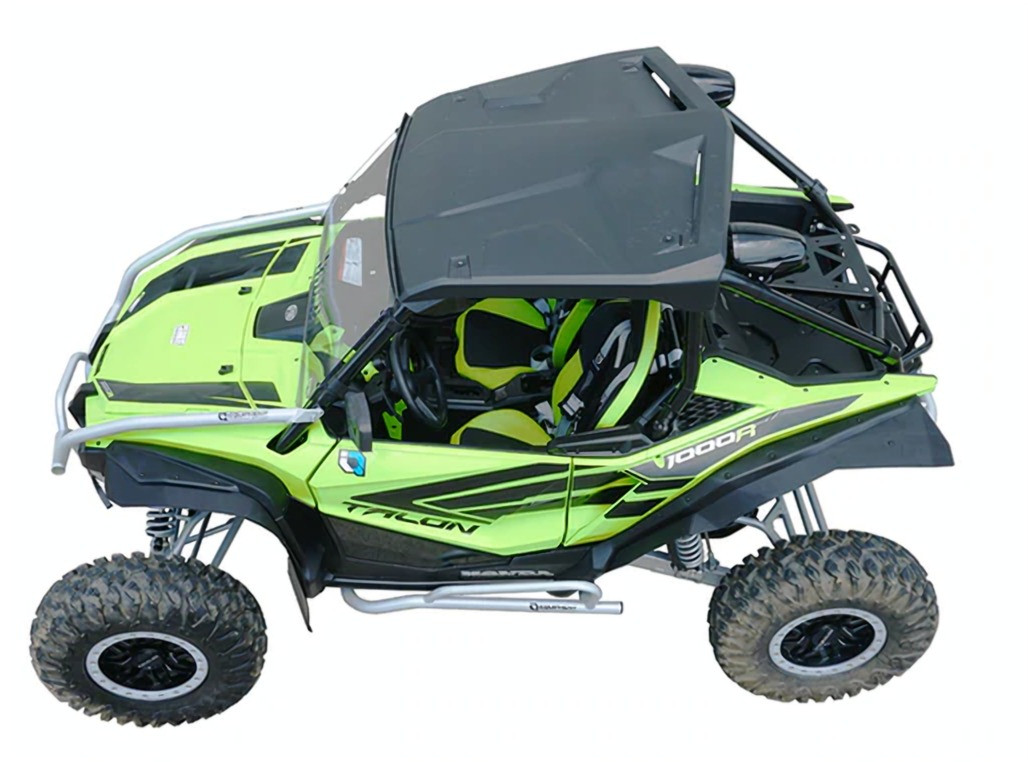 Spike fender flares on a green Honda Talon 1000R with roof and rock sliders, overhead front three-quarter view on white