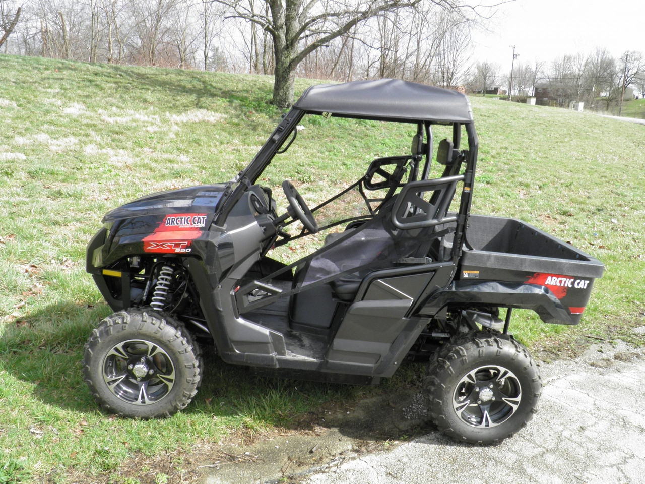 3 Star black soft top on a black Arctic Cat Prowler 550, side view on grass