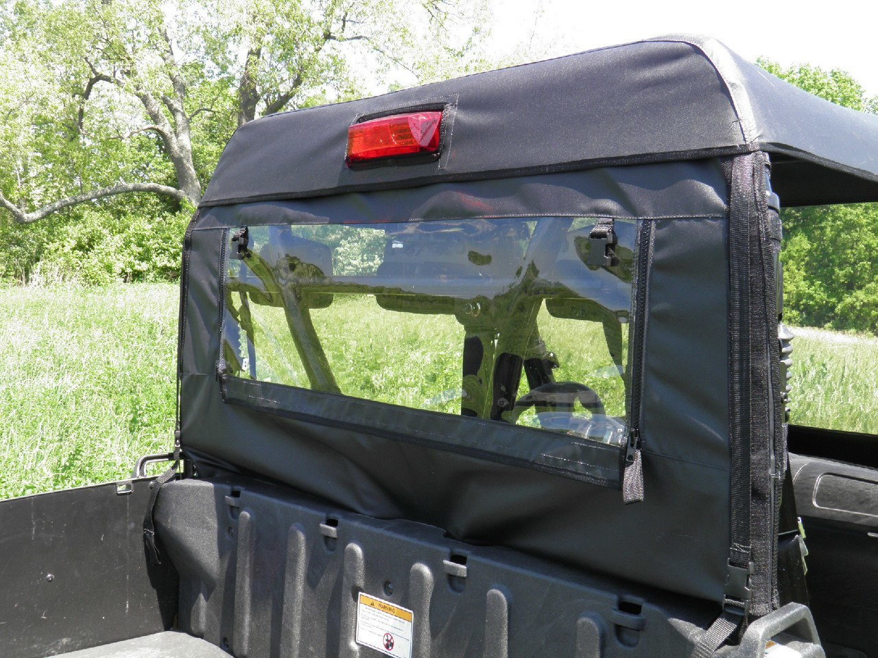 3 Star soft back panel with clear zip window installed under the top of an Arctic Cat Prowler 700, rear view