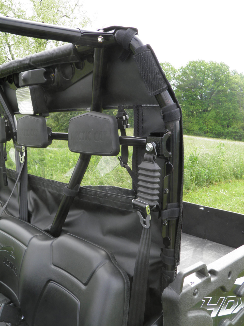 Inside view of the 3 Star soft back panel behind the seats of an Arctic Cat Prowler 700, strap on the cage