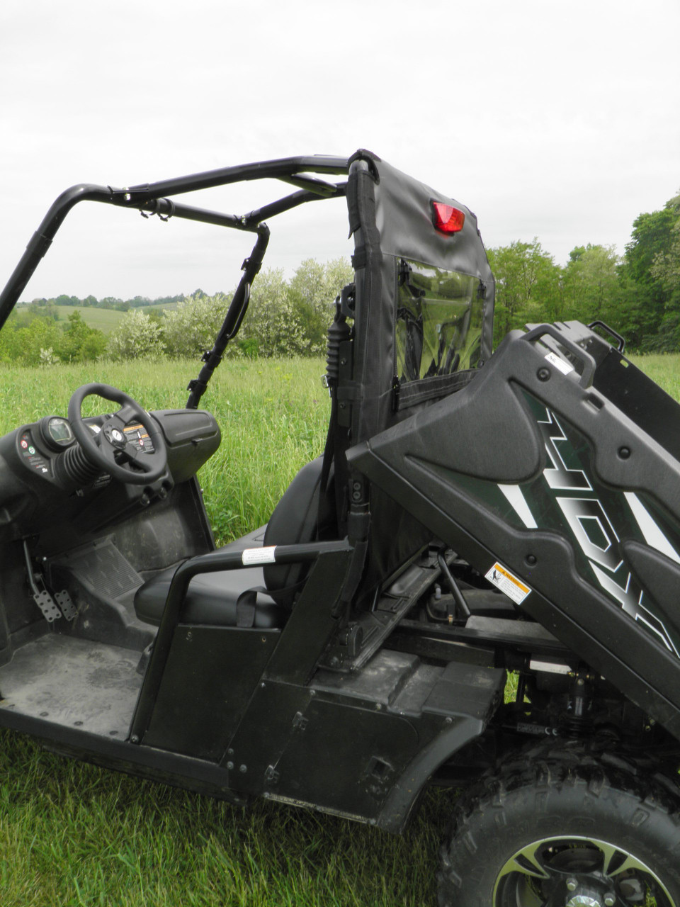 Side view of an Arctic Cat Prowler 700 with the 3 Star soft back panel installed and no roof