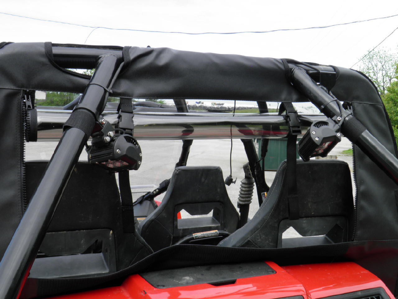 3 Star soft back panel with clear window seen from behind a red Arctic Cat Wildcat 4