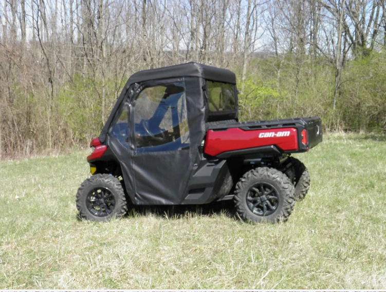 Rear three-quarter view of a red Can-Am Defender with the 3 Star cab enclosure and rear window installed