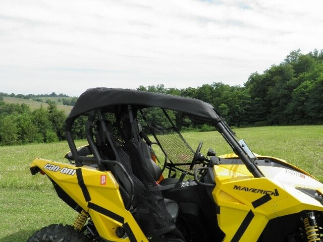Side view of the 3 Star soft top mounted on the roll cage of a yellow Can-Am Maverick