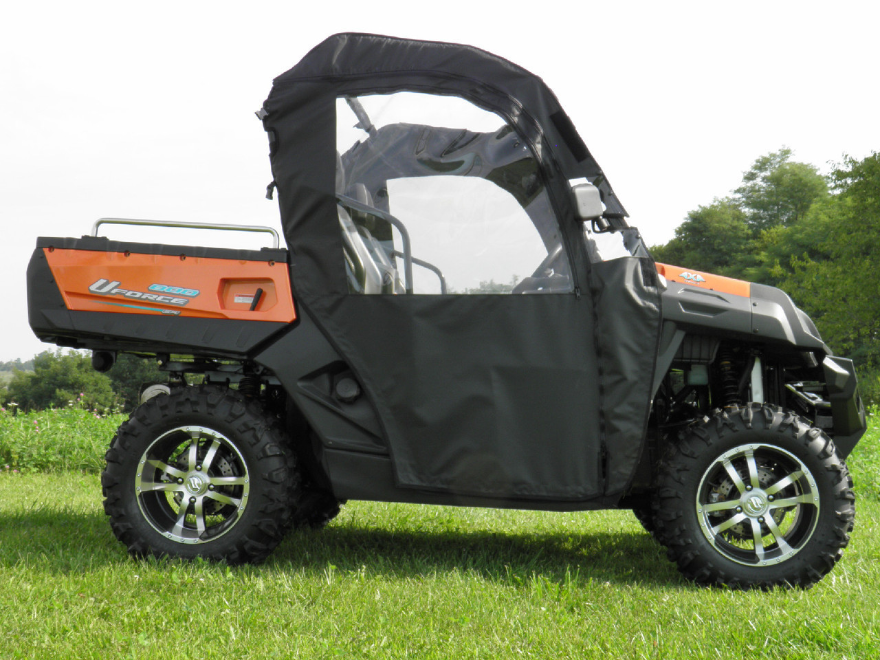 3 Star soft full doors in black on an orange CF Moto UForce 500/800 with soft top, side profile in a field