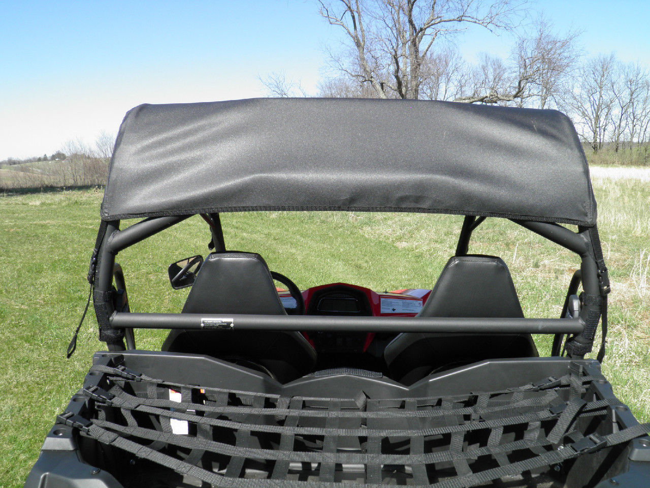 Red CF Moto ZForce with only a 3 Star soft top installed, rear view from the bed