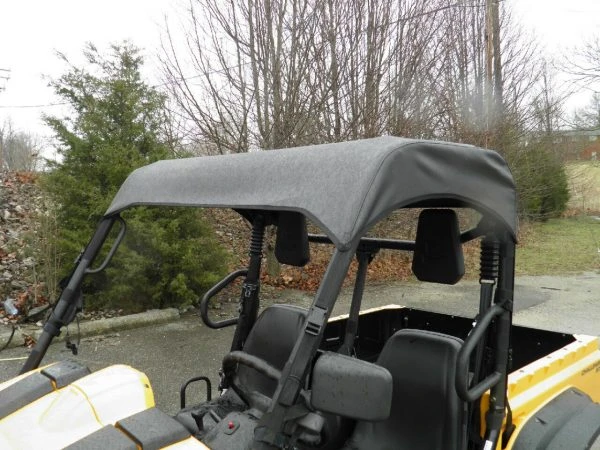 Side profile of the 3 Star soft top stretched over the cage of a yellow Cub Cadet Challenger