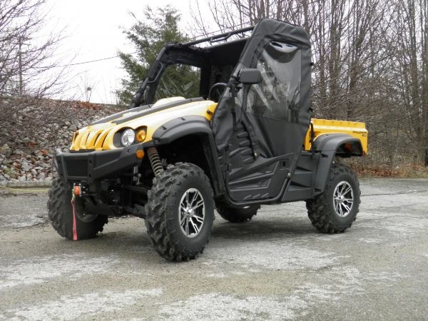 3 Star soft doors on a yellow side-by-side with soft top, front three-quarter view on pavement