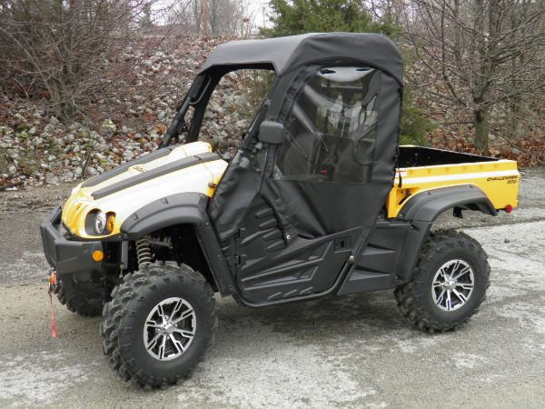 Front view of the 3 Star soft doors and rear window combo on a yellow side-by-side, driver door and roof visible