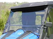 Small front view of the 3 Star two-piece windshield on a blue side-by-side with a black roof