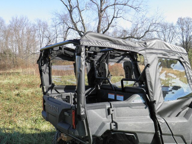 Rear passenger side view of the Honda Pioneer 700-4 showing the 3 Star soft doors, rear window and tailgate