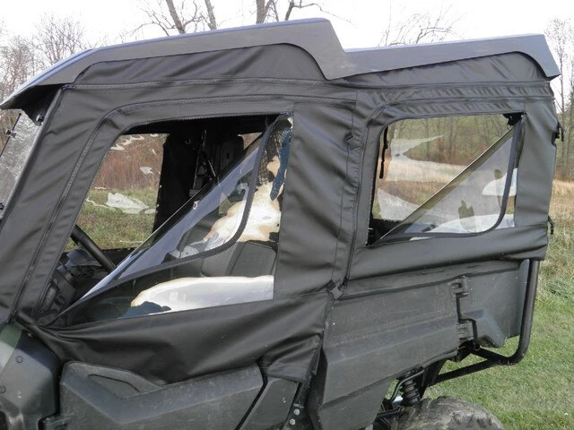 Close side view of both 3 Star soft doors with clear windows on a Honda Pioneer 700-4 under its roof