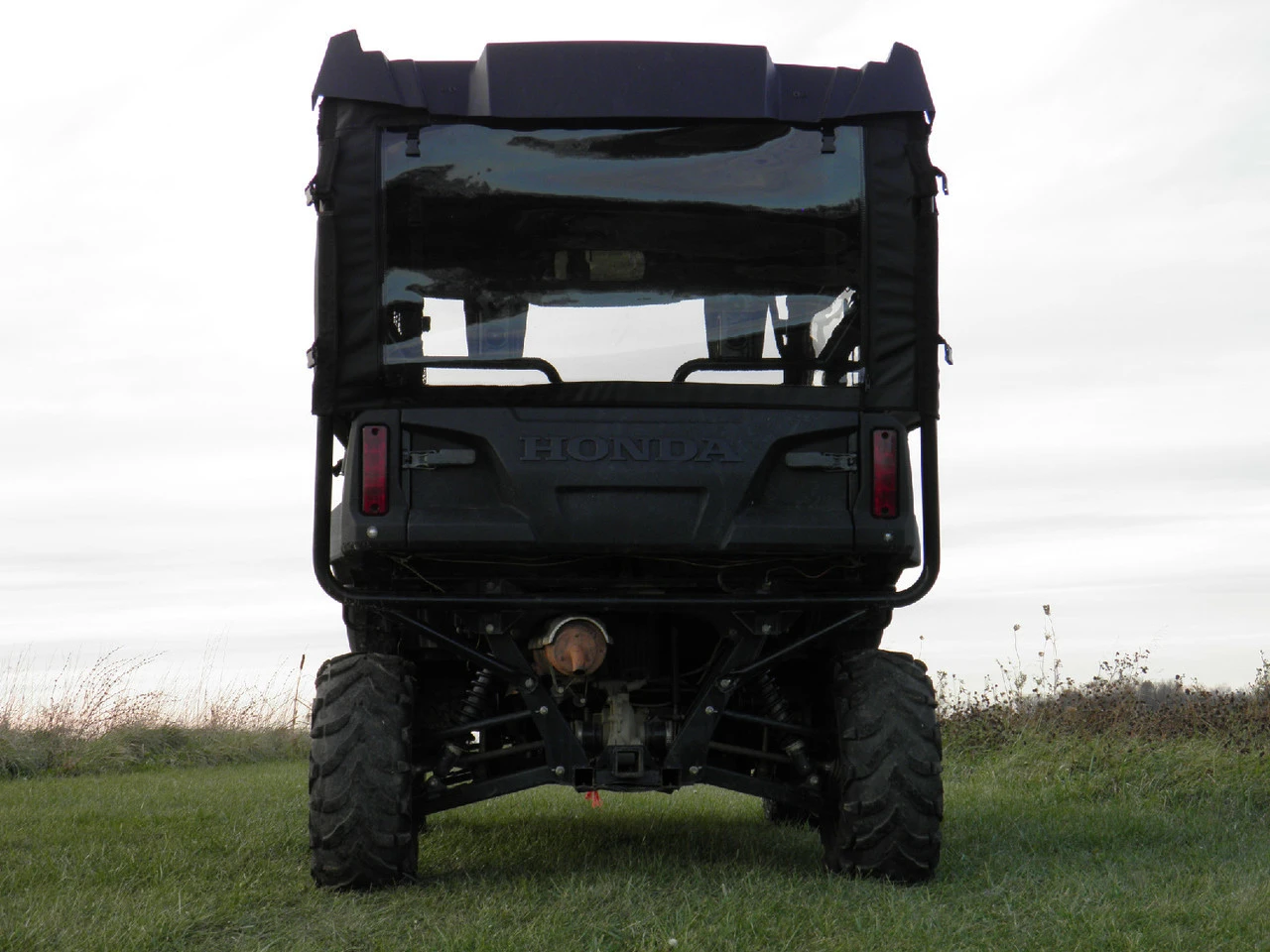 Rear view of a Honda Pioneer 700-4 fitted with the 3 Star soft rear window panel