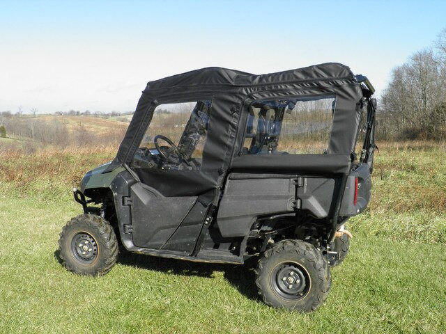 Driver side profile of the green Honda Pioneer 700-4 with all four 3 Star soft doors and clear windows