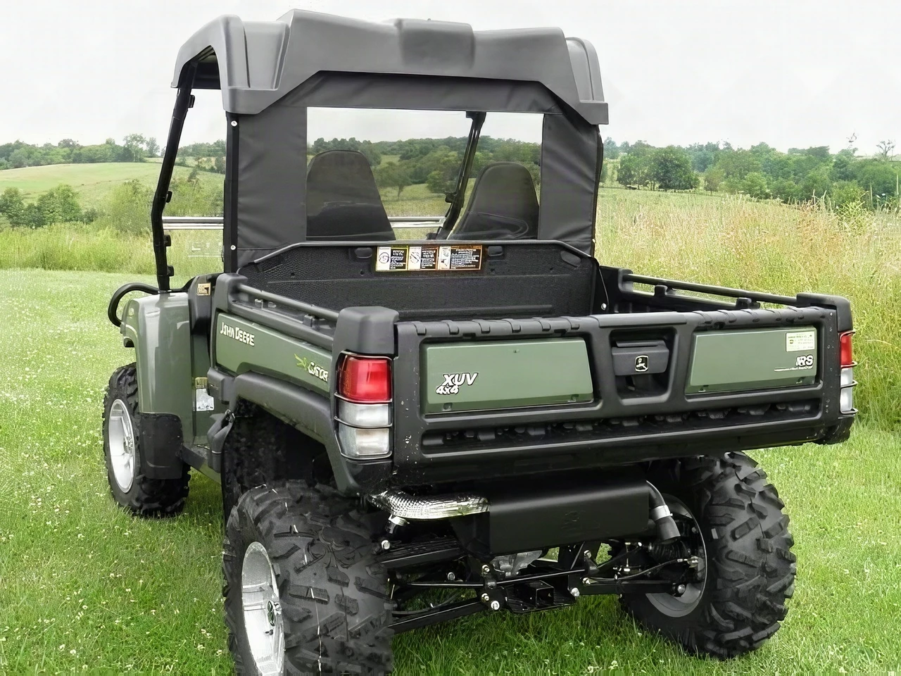 3 Star soft back panel with clear window behind the cab of an olive green John Deere Gator HPX/XUV, rear three-quarter view