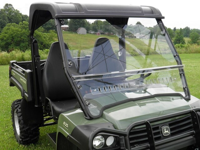 3 Star 2-piece windshield installed on a green John Deere Gator XUV, front three-quarter view showing the vented lower panel