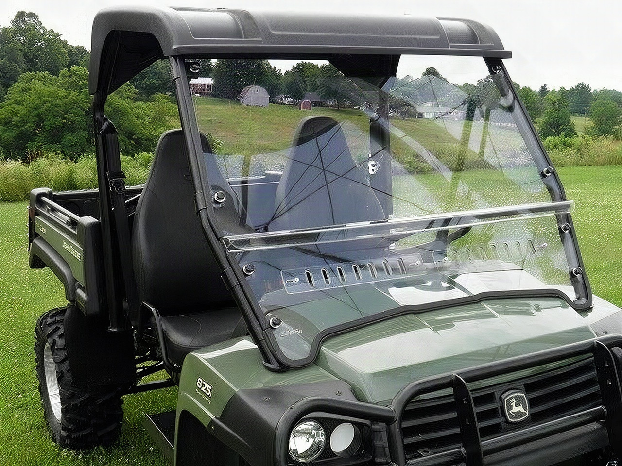 3 Star 2-piece windshield installed on a green John Deere Gator XUV, front three-quarter view showing the vented lower panel