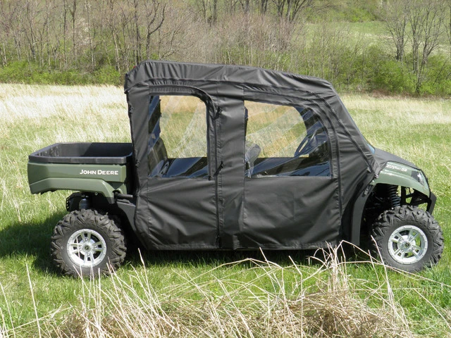 3 Star black full cab enclosure with vinyl windshield and doors on a green John Deere Gator S4 in tall grass, side view