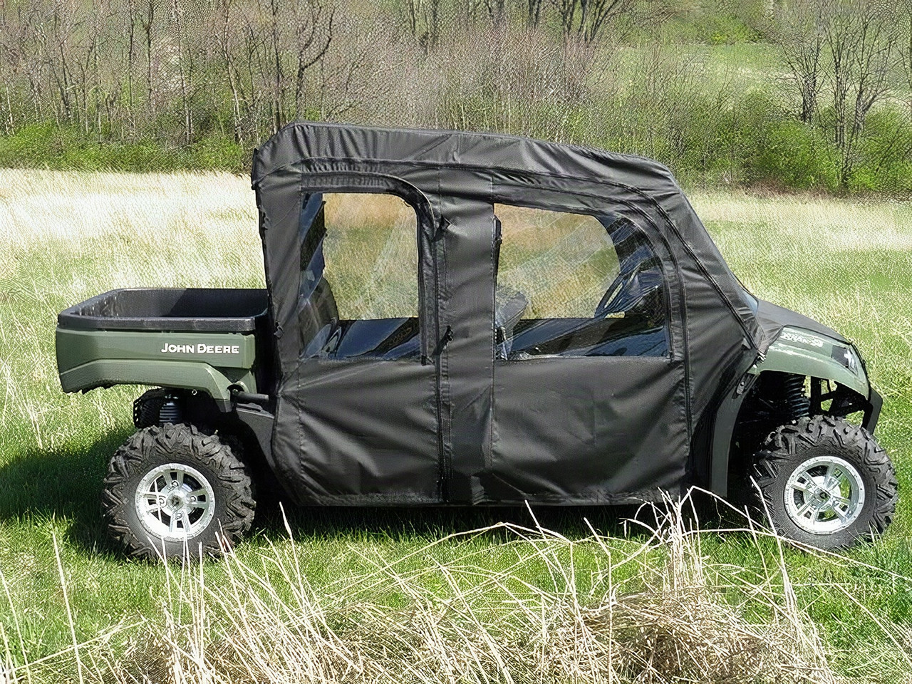 3 Star soft doors and rear window installed on a green John Deere Gator XUV S4, side profile in a field