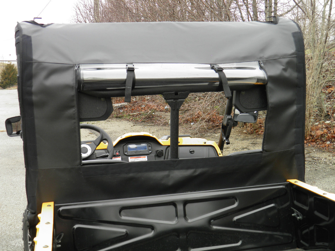 3 Star soft back panel clear window viewed from a yellow cargo bed, with the roll bar and dash visible through it