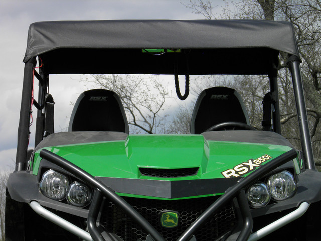 Direct front view of the 3 Star soft top front edge above the hood and headlights of a John Deere Gator 850i