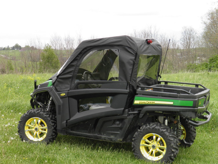 Front three-quarter view of the 3 Star soft doors with clear windows on a green John Deere Gator 850i