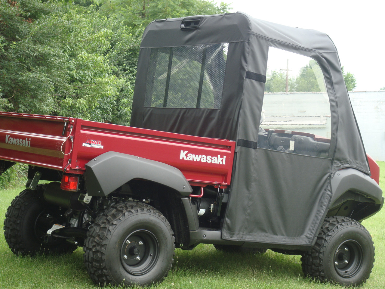 Rear three-quarter view of the 3 Star soft doors and rear window on the red Kawasaki Mule 4000/4010