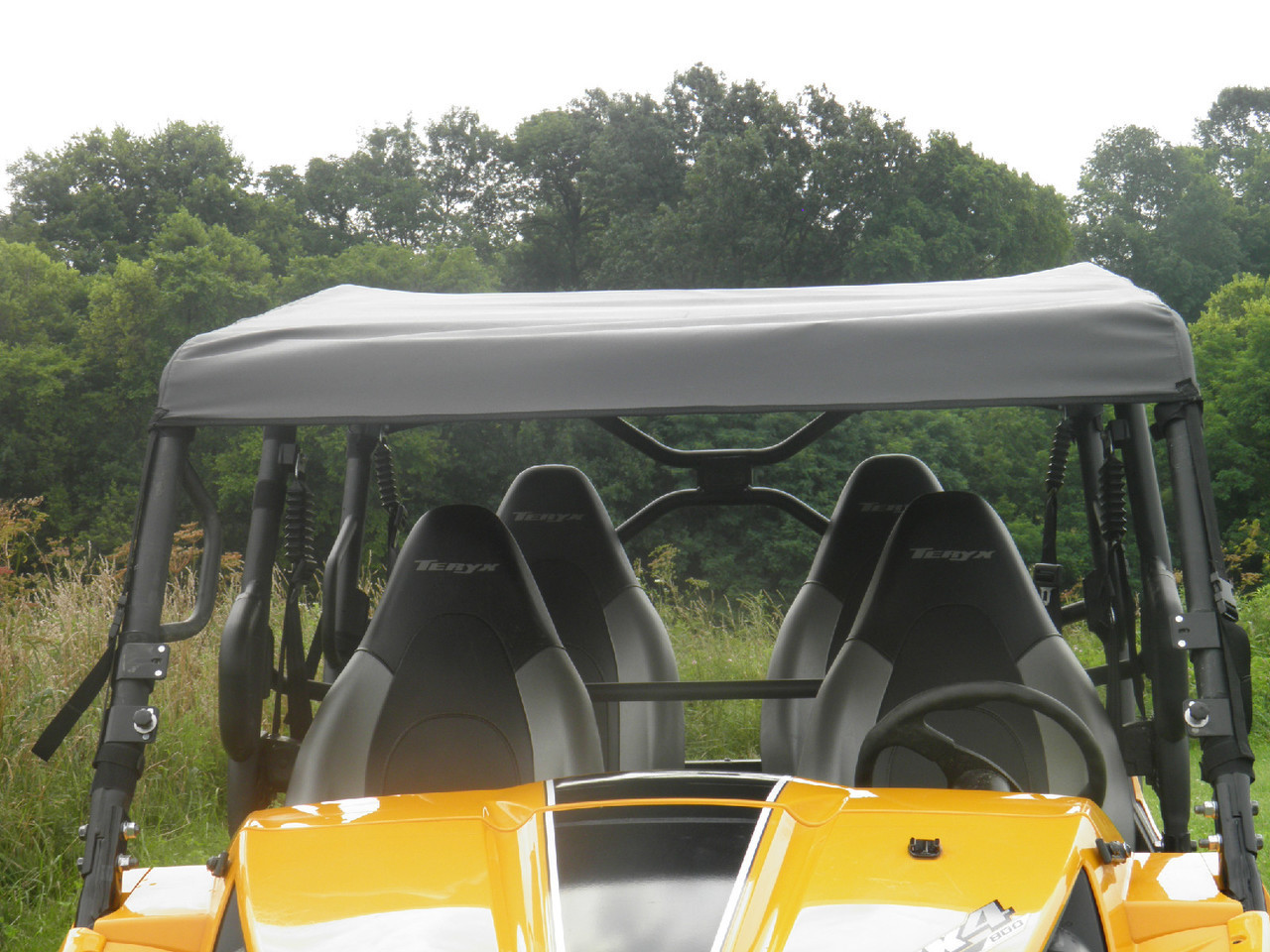 3 Star gray soft top installed over the four seats of a yellow Kawasaki Teryx 4, front view over the hood