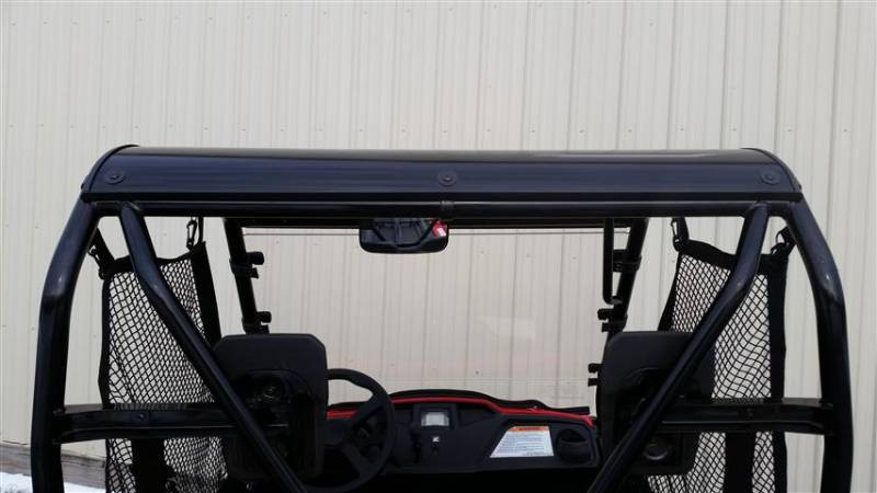 Rear view of the Extreme Metal Products aluminum top over the cage and seats of the Honda Pioneer 500 in a garage