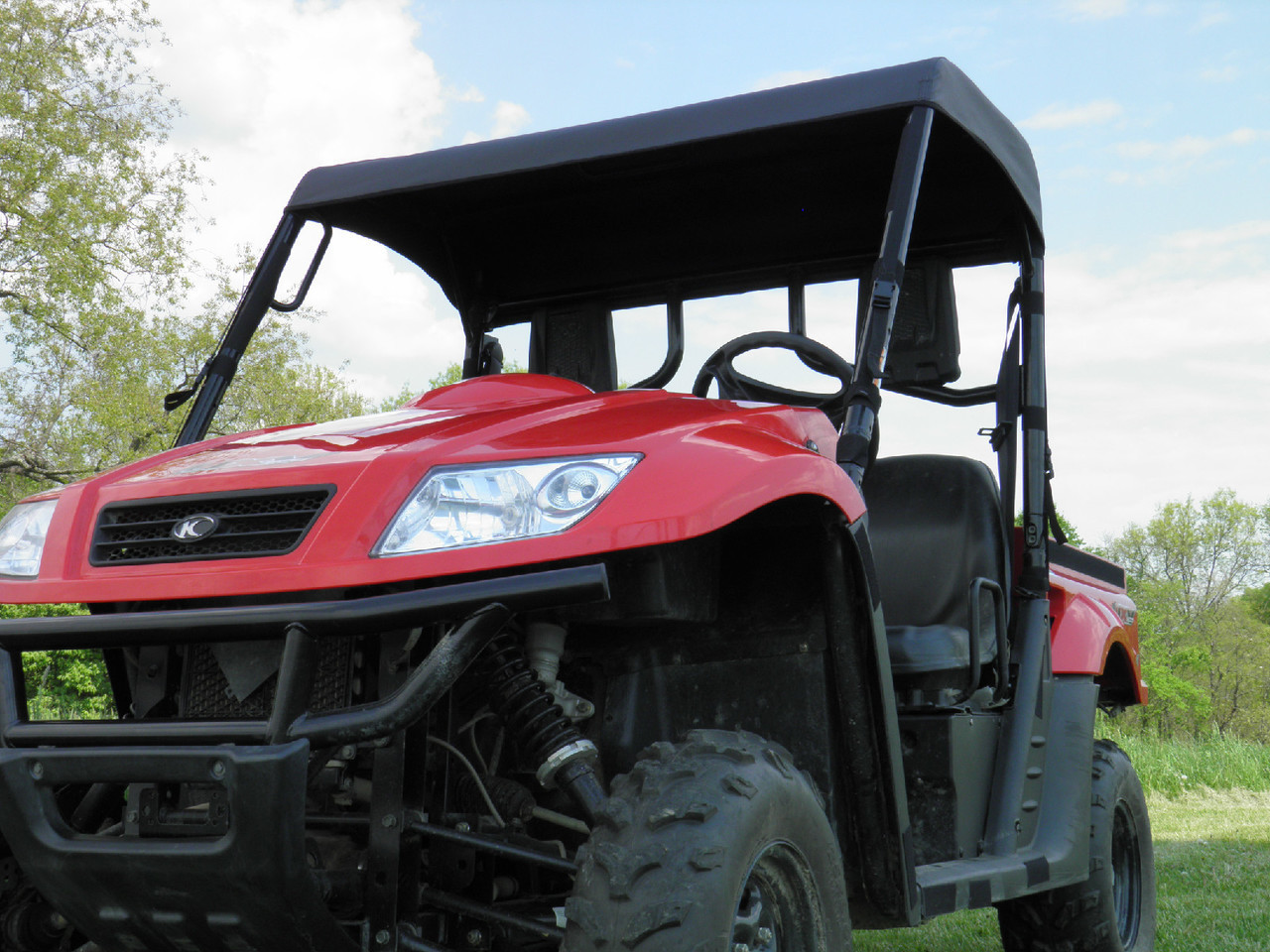 Front three-quarter view of the red Kymco 500 wearing the 3 Star soft top