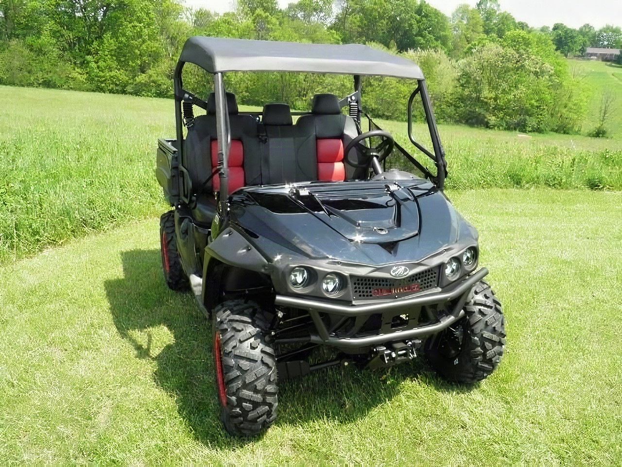 3 Star gray soft top on a black Intimidator Classic with red seats, front three-quarter view in a field