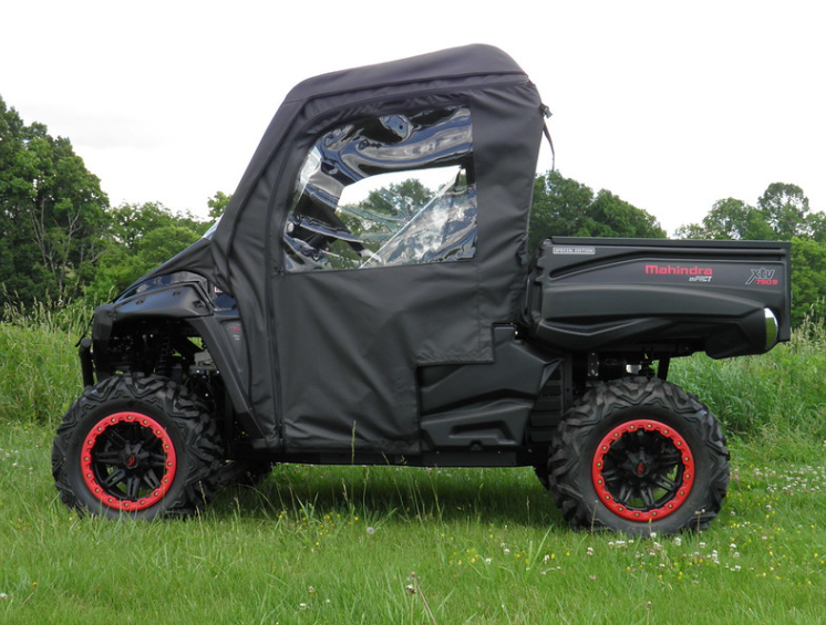 Side view of the 3 Star full cab enclosure with soft doors on a black side-by-side with red wheel rims