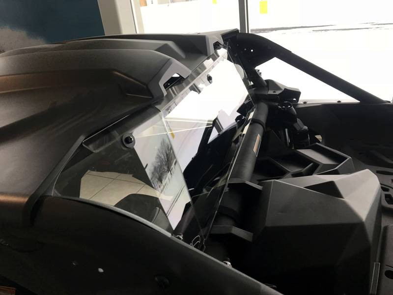 Side view along the rear cage of a Can-Am Maverick X3 showing the Extreme Metal Products clear cab back panel