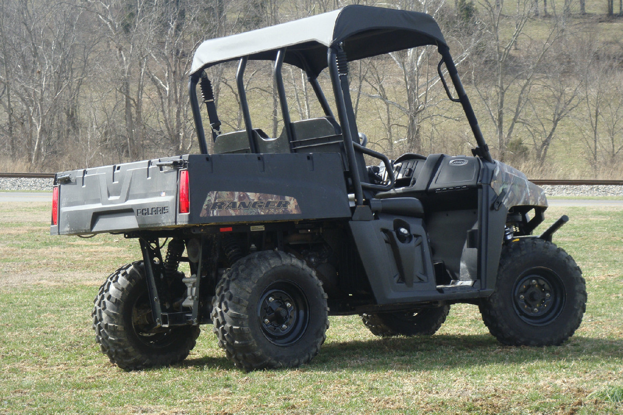 3 Star gray soft top on a camouflage Polaris Ranger 570, rear three-quarter view on grass
