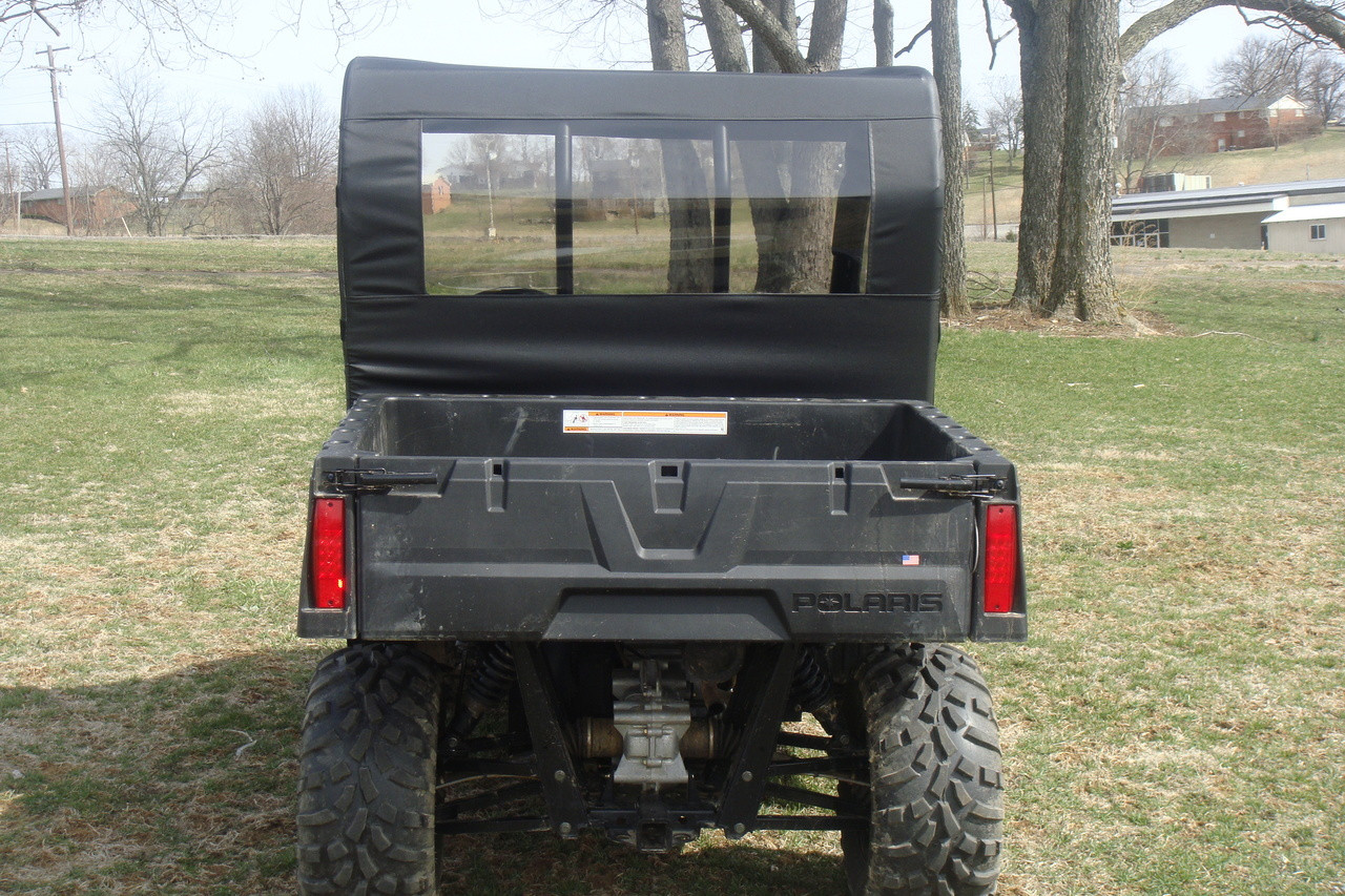 Straight rear view of the green Polaris Ranger showing the 3 Star soft rear window panel