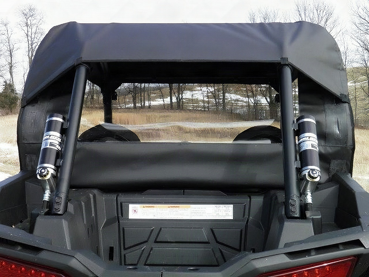 3 Star soft back panel in black with clear window behind the seats of a black Polaris RZR, rear close-up