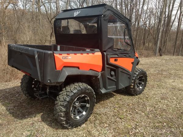 Side X Side upper doors kit on an orange Intimidator GC1K, rear three-quarter view showing the rear window