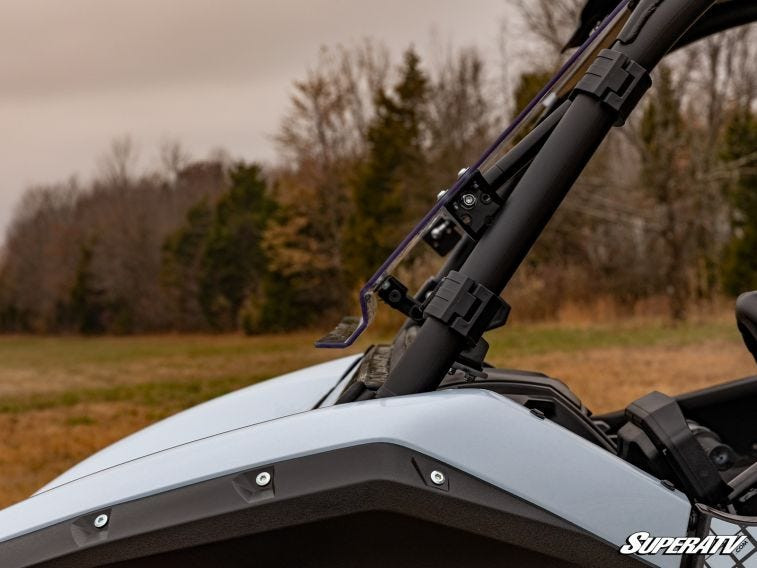Close-up of the SuperATV flip windshield side pivot on the Kawasaki Teryx KRX 1000 cage tube