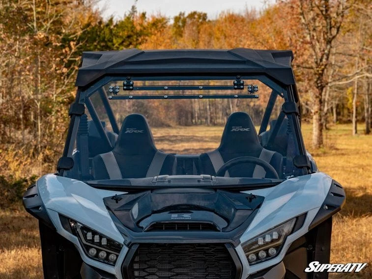 Straight-on front view of the Kawasaki Teryx KRX 1000 showing the SuperATV full windshield and centered top vent