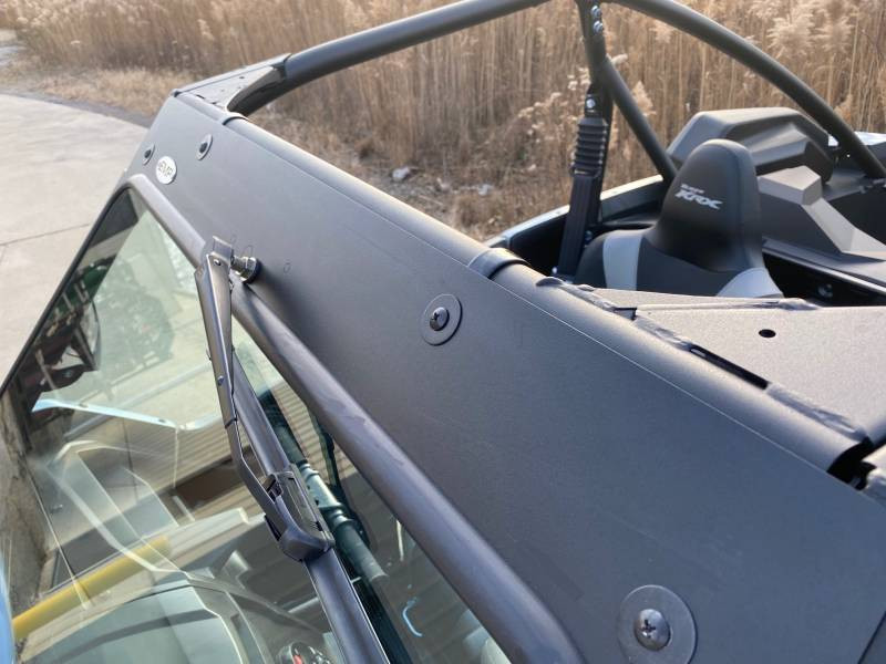 Outside close-up of the Extreme Metal Products windshield side frame and clamp on the Teryx KRX driver side