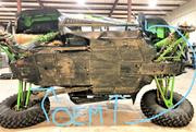 Side view of a Kawasaki Teryx KRX on a lift showing Trail Armor skid plate coverage under the chassis