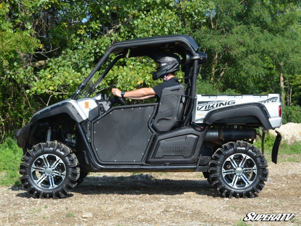 Side profile of a silver Yamaha Viking with the SuperATV 2-inch lift kit installed, driver seated