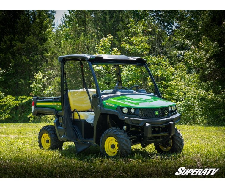 SuperATV 2 inch lift kit installed on a green John Deere Gator XUV 835 with yellow wheels, front three-quarter view