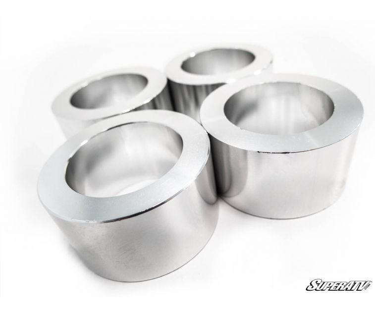 Four polished aluminum lift spacers included in the SuperATV John Deere Gator XUV 835 2 inch lift kit