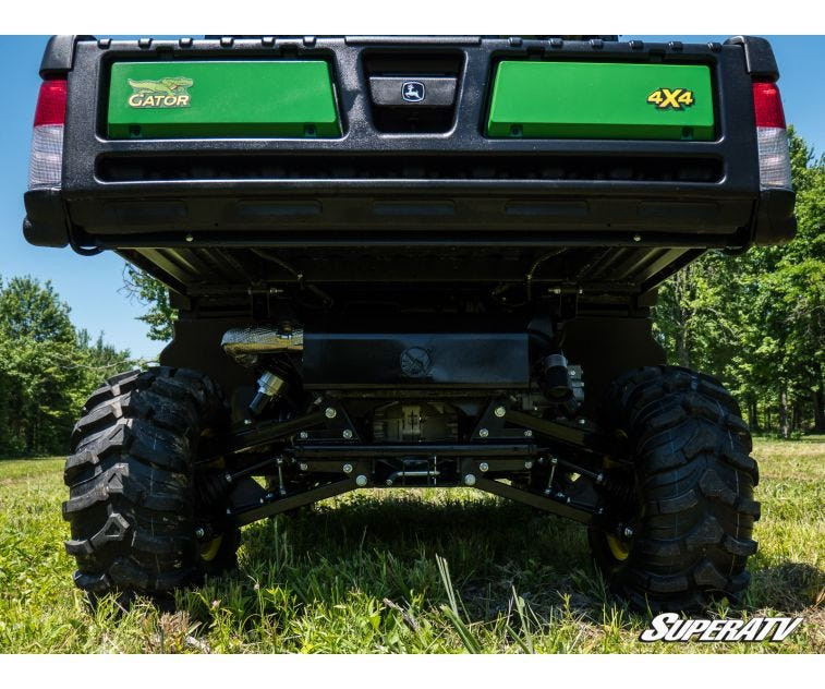 Low rear view of a John Deere Gator XUV 835 on the SuperATV 2 inch lift kit showing rear suspension clearance