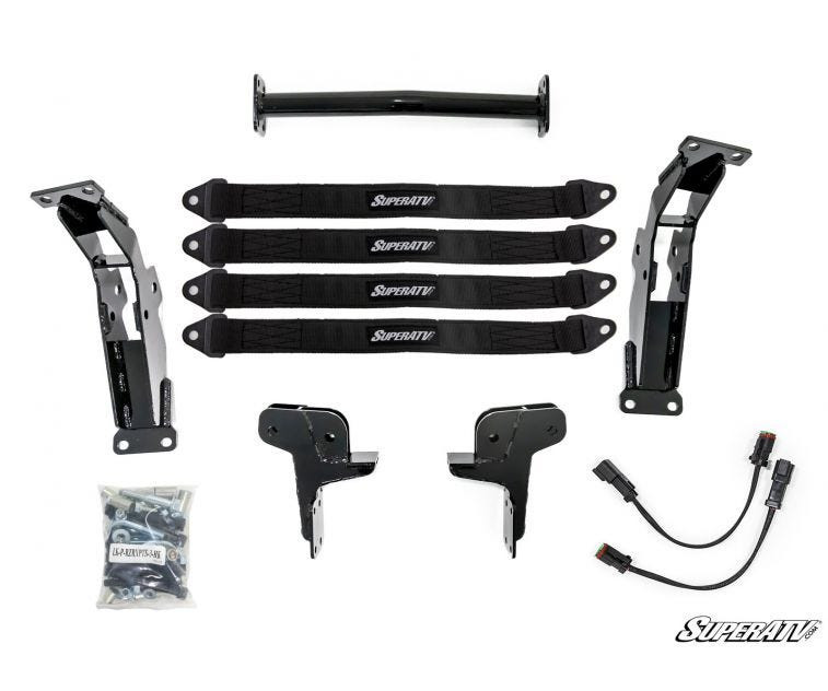 SuperATV 3-inch lift kit components for a Polaris RZR XP Turbo S laid out: brackets, limit straps, wiring and hardware